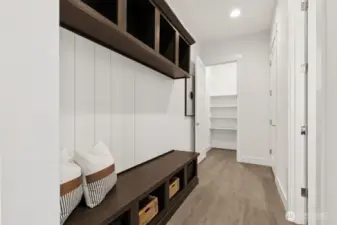 Garage entry, extra storage and powder room. This is a great space to drop coats and shoes.