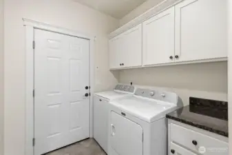 Laundry room off kitchen leading to Garage