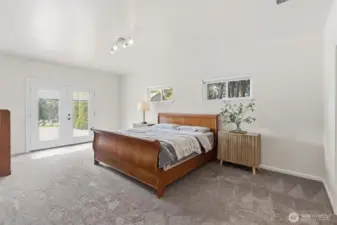 Expansive Primary Suite with french doors to patio