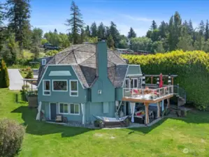 3-levels of architecturally stunning home with soaring 24' ceiling, 4 Bedrooms, 4 Bathrooms, full MIL Apt., huge wrap-around Deck, covered Patio with Hot tub & so much more!
