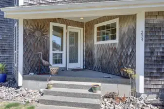 Welcome!  Covered porch welcomes guests on sunny or rainy days