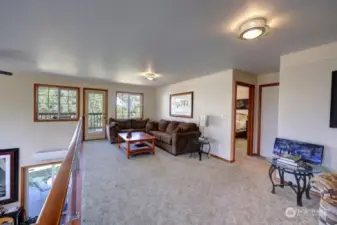 Loft space overlooks the great room.  Open the door to the covered deck