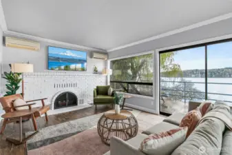 The living and dining room lead to a wrap around deck, perfect for outdoor dining.
