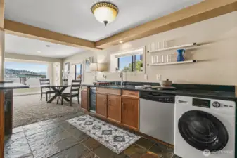 The lower level of the home features a second kitchen, a spacious living area, and is perfect for an extended guest stay or for a multi generational living situation.