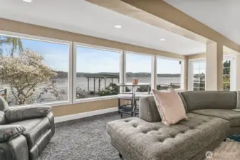 Floor to ceiling windows bathe the living room in natural light even on the grayest of Seattle days!