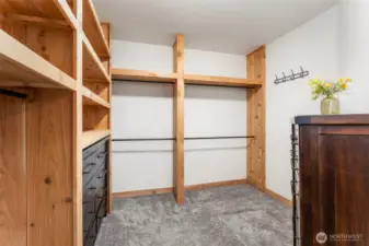 Huge primary closet with cedar shelving... approx 120 sqft!