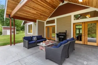 Covered back patio with stamped concrete, cedar tongue and groove ceilings and plumbed for gas for propane BBQ.