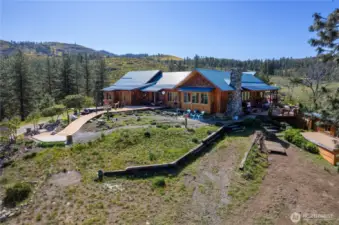 Privacy, 360 degree views and beautiful custom home.