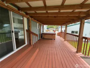 Well maintained deck with a full sized hot tub.