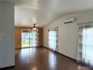 From the living room to the dining room view. Ceiling fan and Mini-Split heating and cooling.