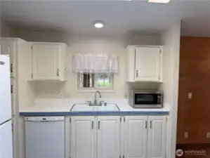 Note dishwasher and more storage space.  Sink is right where it should be, at the kitchen window.