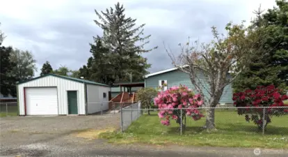 Garage and workshop add to the value of this charming home.