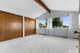 Primary suite upstairs w/ a huge view of the Narrows bridge, vaulted ceilings, and a wall of closets