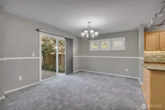 Slider off dining room provides direct backyard access.