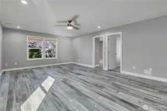 Upper-level bonus room with laminate vinyl plank flooring that offers durability and style.