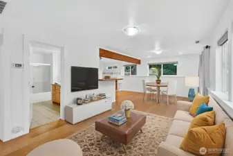 Lower unit living space. Full Bathroom, full kitchen, 1 bedroom w/ walk-in closet. LOTS of natural light.   *virtually staged*