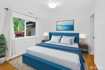 Lower unit bedroom w/ walk in closet and views of private backyard. *virtually staged