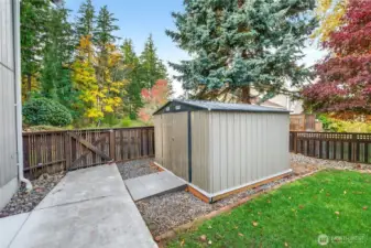 Metal shed for additional storage in backyard.