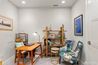 Quiet flex room. Just off the entry, a versatile flex room offers the perfect spot for a stylish home office, cozy guest space, or reading nook. Large closet with custom built-in shelving and storage space.