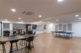 Game & Kitchen Zone  Entertain with ease in this well-appointed shared space featuring a full kitchen, dining tables, and game area including ping pong and lounge zones.