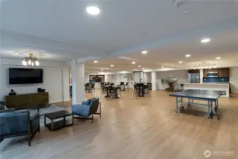 Media & Lounge Area  Kick back in the media lounge with a wall-mounted TV, modern furnishings, and direct access to the event-ready communal kitchen and game zone.