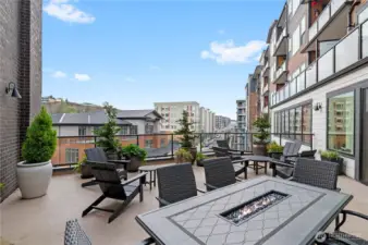 Outdoor Terrace with Fire Table  Enjoy fresh air and city views from the spacious shared terrace—complete with cozy seating and a built-in fire table for year-round ambiance.