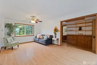 Living room with built-in shelves in the hallway in the distance ...