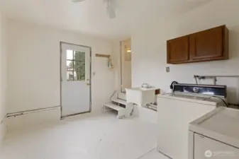 Another view of the laundry room with access to the outside ...