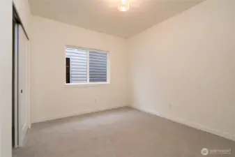 Guest Bedroom (Bedroom #2 on Floorplan) - Pics are of a different 2014 plan. Features and colors may differ.