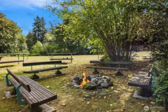 Designed for (and used much!) for gathering...built-in seating around a fire-pit, with large permanent banquet tables beyond, set the stage for community interactions large and small.