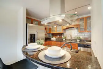 A peninsula offers bar stool seating for casual meals.