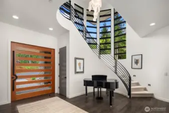 We love the 6' pivot custom entry door and the beautiful custom lighting throughout.