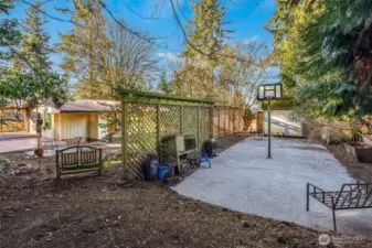 Spacious yard with sport court and large shed