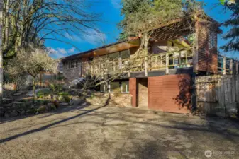 Carport under the deck has privacy screens installed