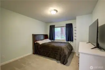 2nd bedroom overlooks treed area