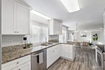 The kitchen provides ample counter and cabinet space. The floors are low maintenance ceramic tile.