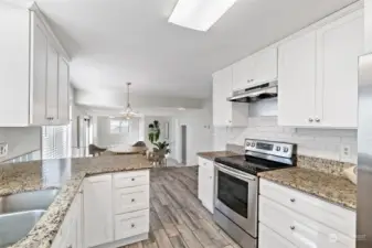 The kitchen flows to the breakfast nook and family room.