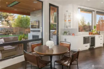 A second serving area with beverage refrigerator, dishwasher and massive quartz counters and storage.