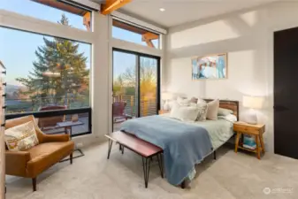 Second en-suite bedroom on the upper level with oversized deck and floor to ceiling windows to savor the sights.