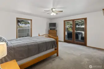 The primary bedroom is good size and has access to the back deck and hot tub!