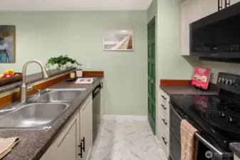 Open living/dining/kitchen w/ slider opening to patio & yard space