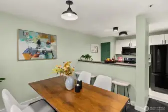 Open living/dining/kitchen w/ slider opening to patio & yard space