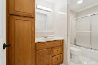 Bath with tile floor and walls
