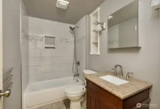 Full bathroom in hallway on upper level