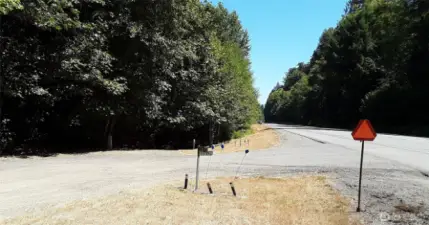 Entry drive looking east; Highway 101 is on right side