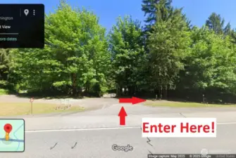 Google View looking north, showing paved apron and entry to gravel drive to property.