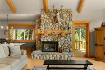 Handsome stone fireplace anchors the living area.