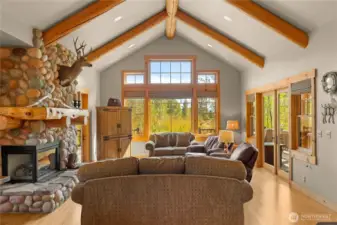 Open living design wrapped in glass to capture the outdoors.