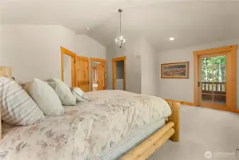 Spacious primary suite with private balcony access, walk-in closet, and ensuite bath.