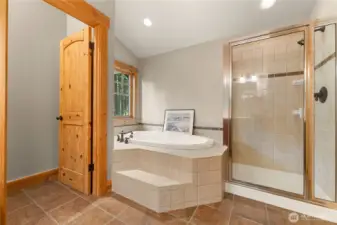 Ensuite bathroom with double vanity and soaking tub.